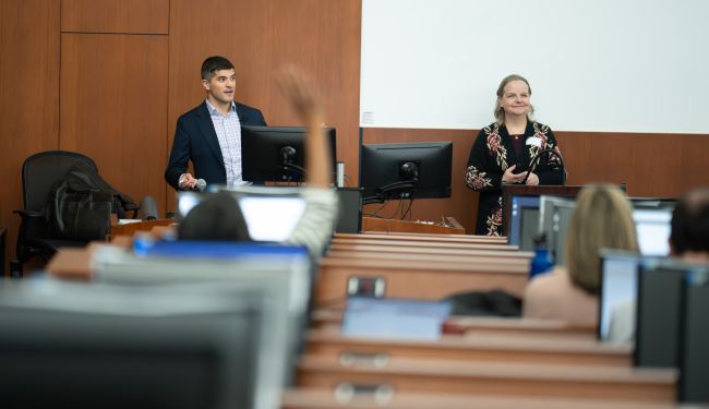 From left: Peter Kleinschmidt, MD, associate professor, and Heidi Twedt, MD, professor, both core faculty for the Section of Applied Clinical Informatics in the Division of General Internal Medicine, lead an interactive breakout session on using artificial intelligence (AI) in teaching and learning.