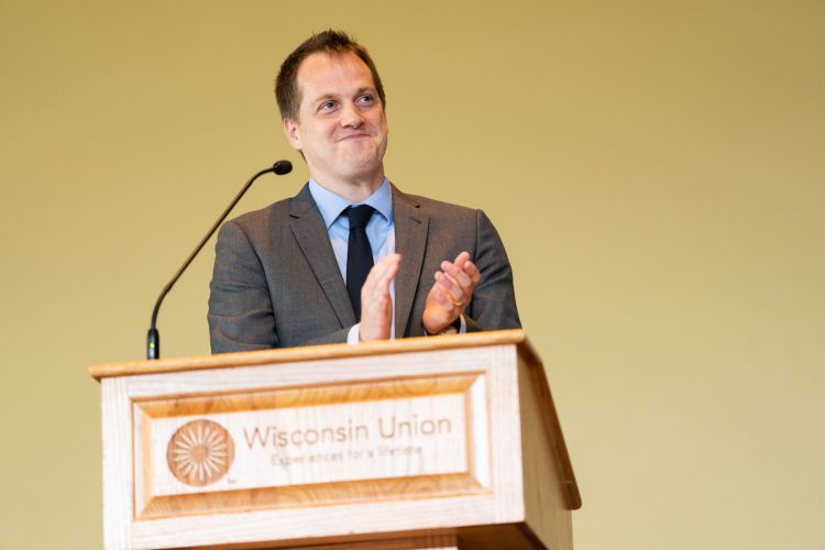 Residency Director Andy Coyle, MD, stands at the podium of the graduation ceremony