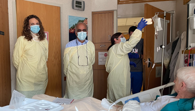 Drs. Uboha (left) and Hematti (right) with their patient, Steve Larson of Iowa City, Iowa, during his first infusion treatment. Photo was provided by the patient. 