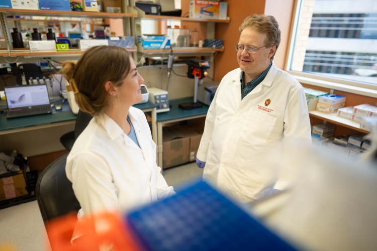 Research assistant and lead author, Michaela Trautman, in the lab with senior author Dudley Lamming, PhD. Credit: Clint Thayer/Department of Medicine.