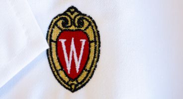 White coat with embroidered UW–Madison crest