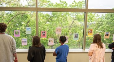trainees and faculty gathered to the read the stories during an ice cream social.