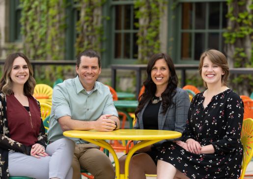 Incoming chief residents, Nadia Sweet, MD, John Davis, MD, Gabby Waclawik, MD, MPH, and Nadia Sweet, MD, sit on the colorful sunburst Terrace chairs