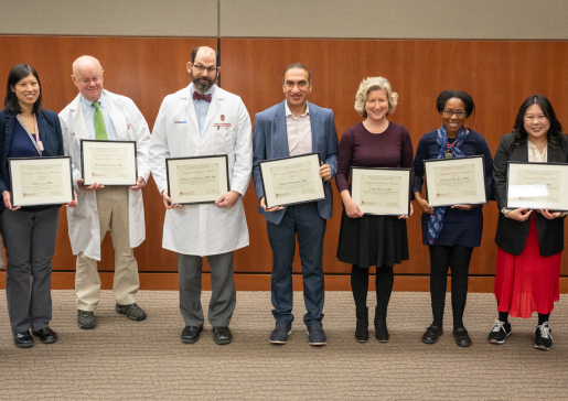 Photo of the 2023 DOM Education Award winners, left to right, between department chair Lynn Schnapp, MD (far left) and Laura Zakowski, MD (far right): Tiffany Lin, MD; Mark Reichelderfer, MD; Zachary Goldberger, MD, MS; Sandesh Parajuli, MD; Laurel Romer, MD; Christine Sharkey, MD; Andrea Schnell, MD.