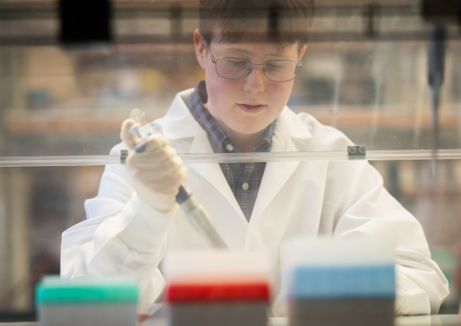 Research specialist Emily Kaufman working in Dr. Mark Burkard's research lab